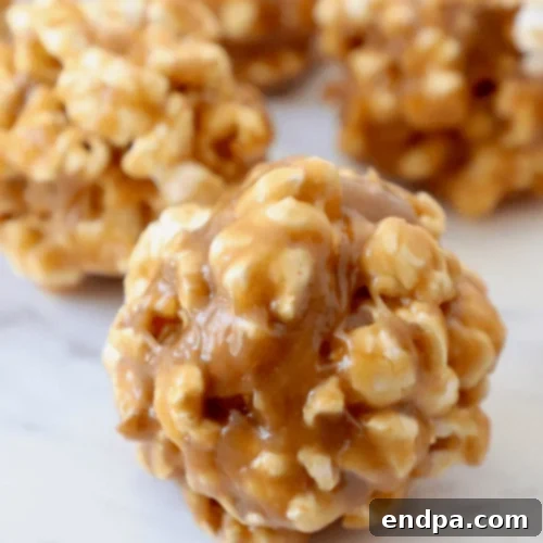 Peanut Butter Popcorn Balls, a perfect balance of sweet and salty.