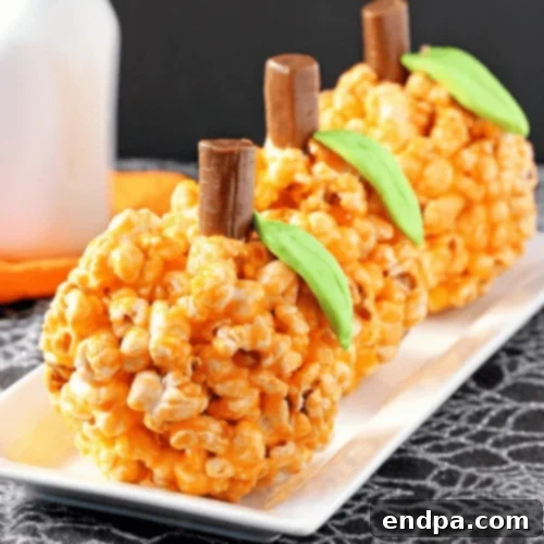 Festive Pumpkin Popcorn Balls, perfect for Halloween and fall celebrations.