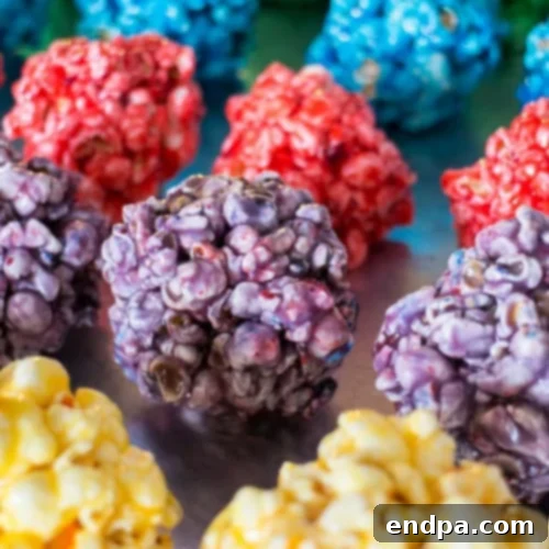 A cluster of vibrant Rainbow Popcorn Balls, showing off their bright, varied colors.