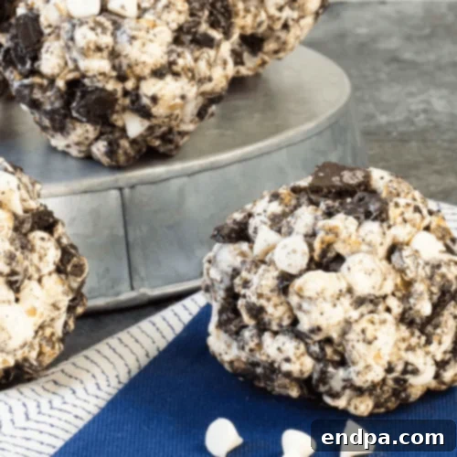 Cookies and Cream Popcorn Balls, featuring crushed dark cookies.
