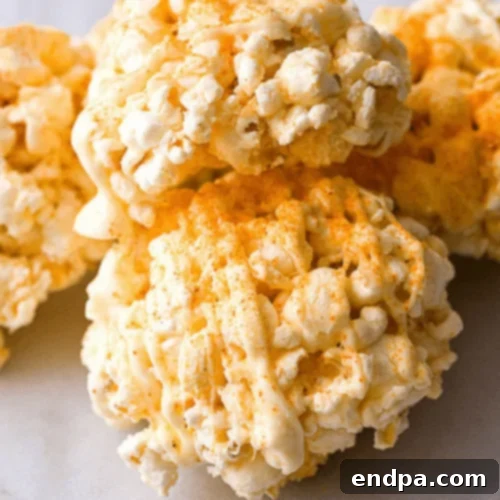 White Chocolate Cayenne Popcorn Balls, offering a surprising sweet and spicy kick.