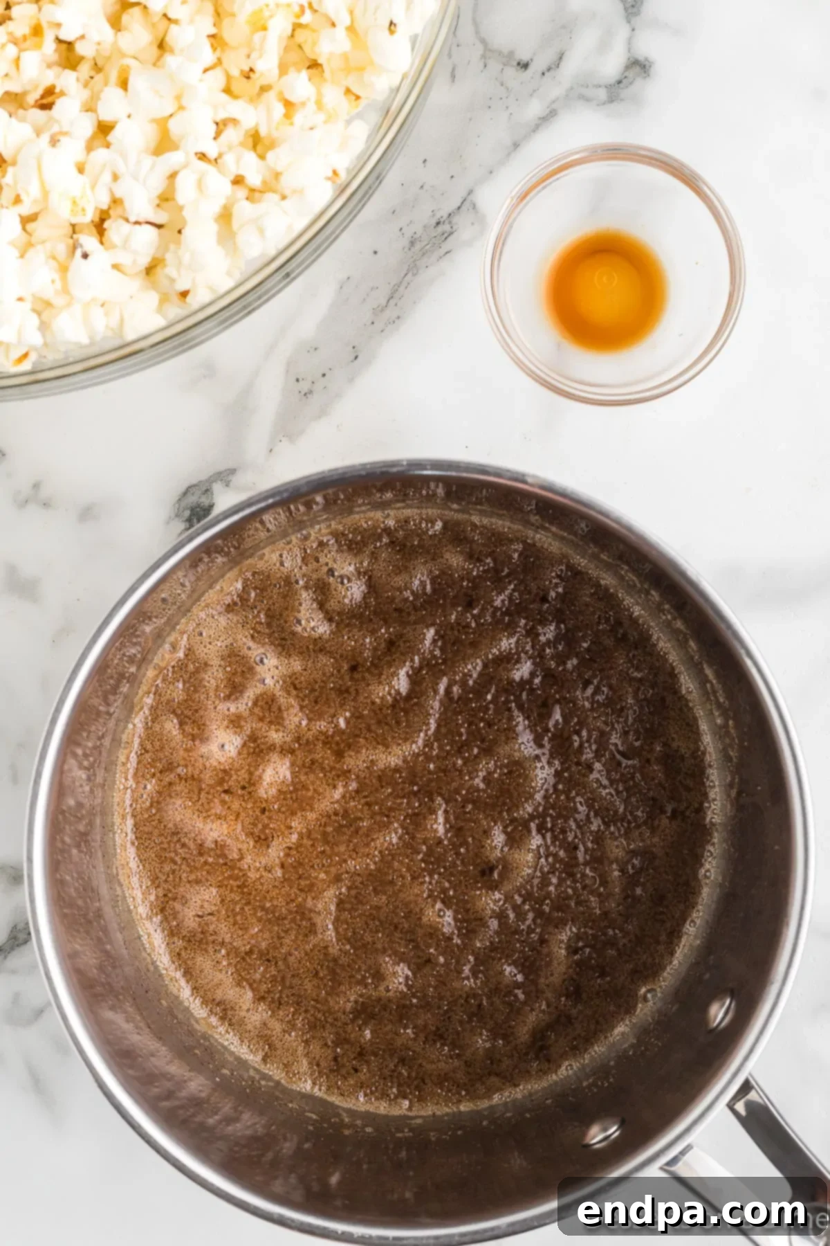 Sugar and butter mixture simmering in a saucepan.