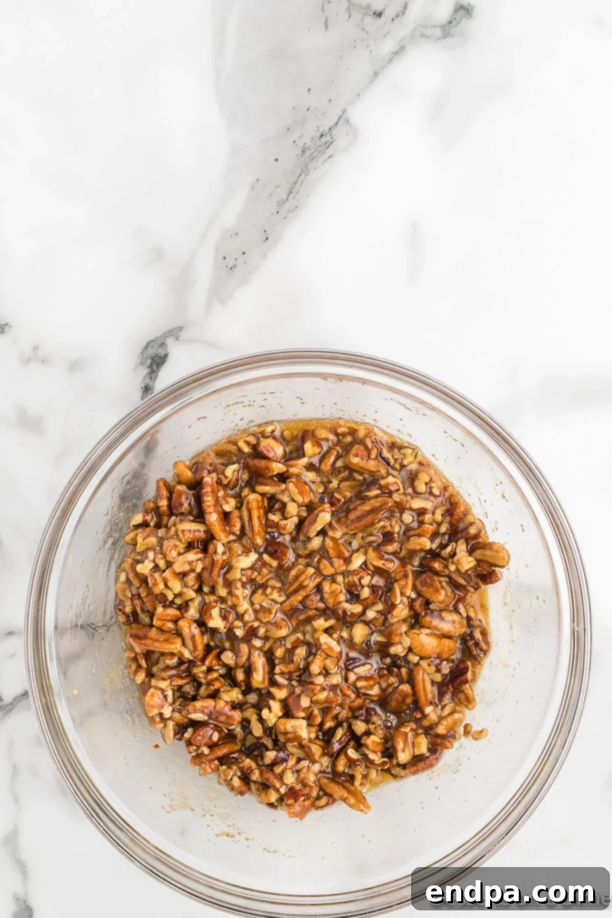 Pecan Pie in a Cookie 5 Pecan pie filling mixture in a mixing bowl, ready to be added to the cookie bases.
