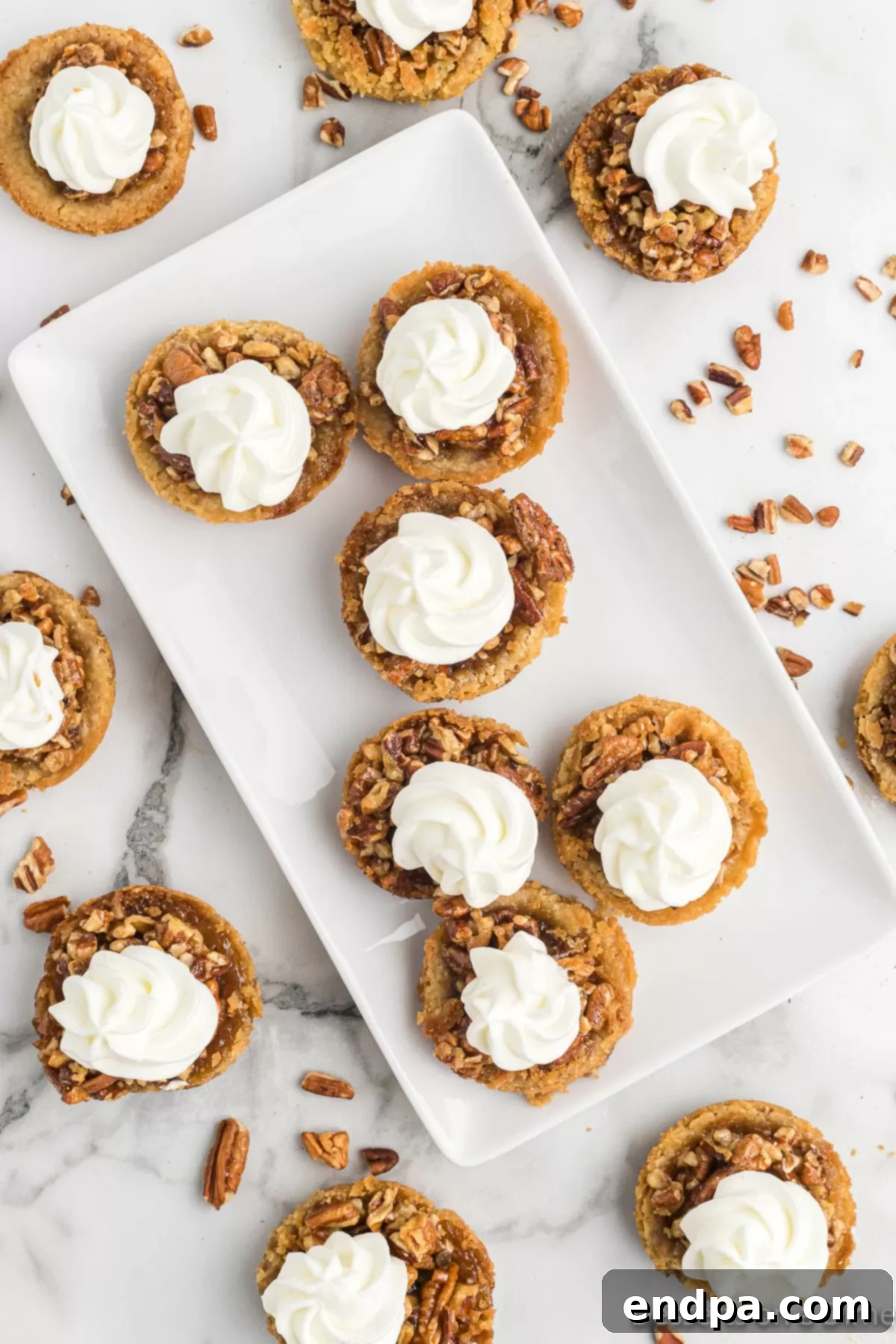 Pecan Pie in a Cookie 8 An array of freshly baked Pecan Pie Cookies displayed on a serving platter, ready for enjoyment.