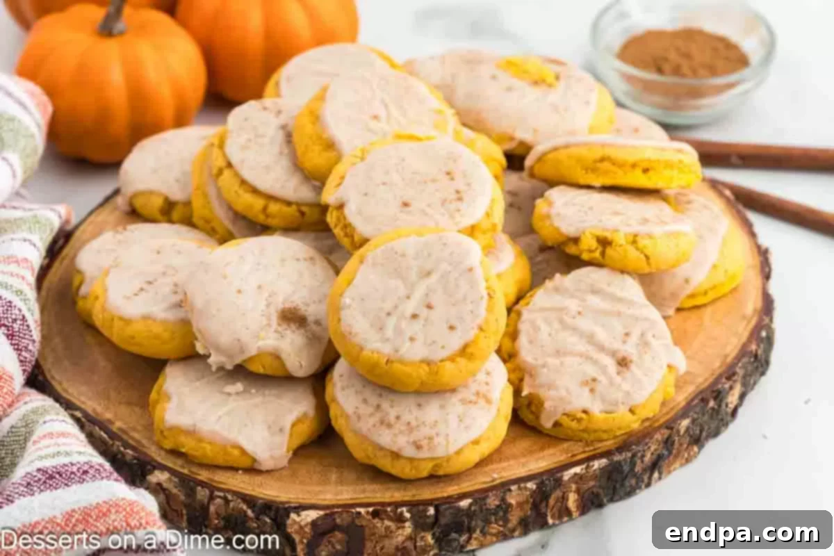 Beautifully arranged Pumpkin Sugar Cookies on a platter, ready to be served for a festive occasion, showcasing their soft texture and delightful glaze.