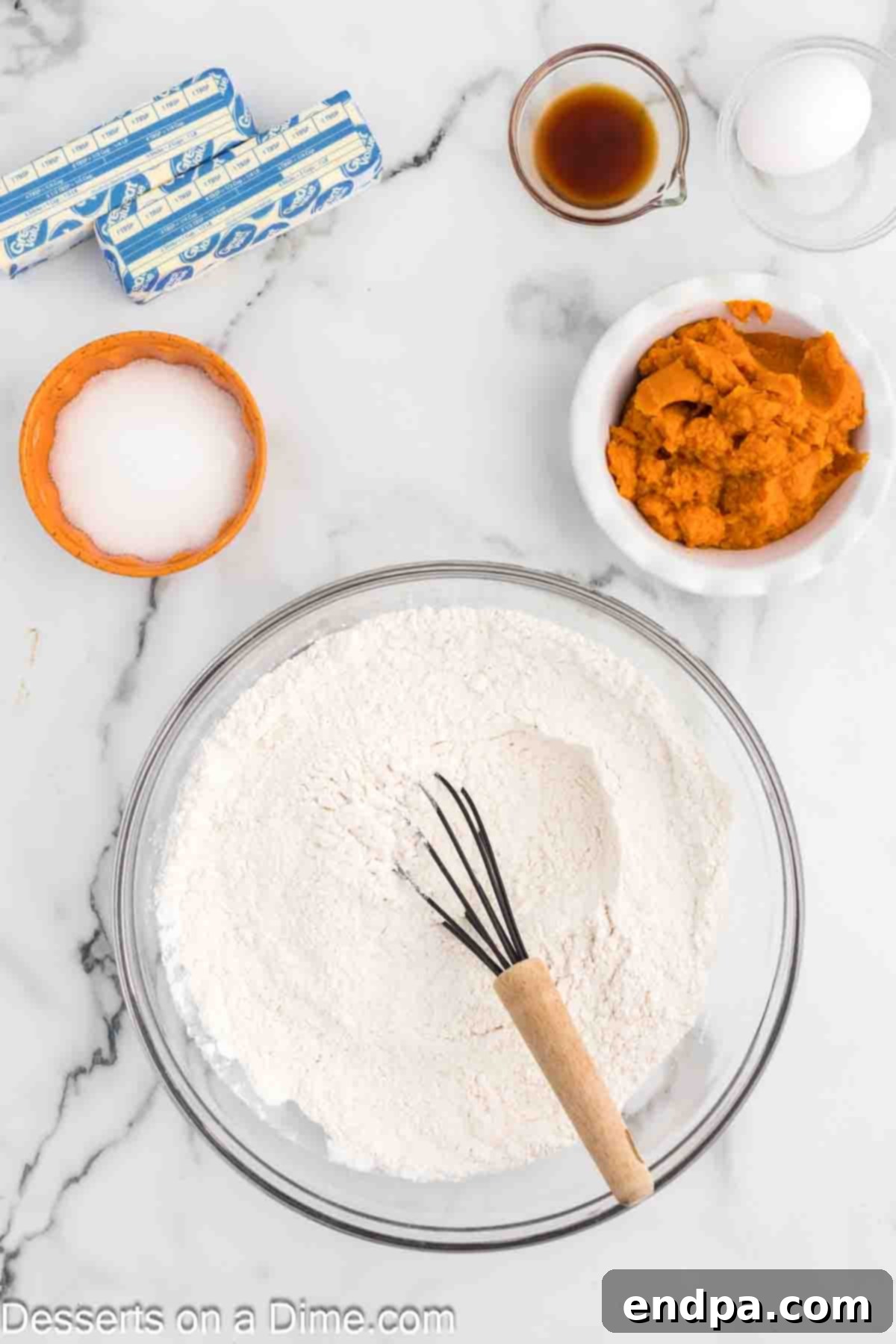 A white bowl containing dry ingredients for the cookies: all-purpose flour, baking powder, and salt, perfectly whisked together to ensure even distribution.
