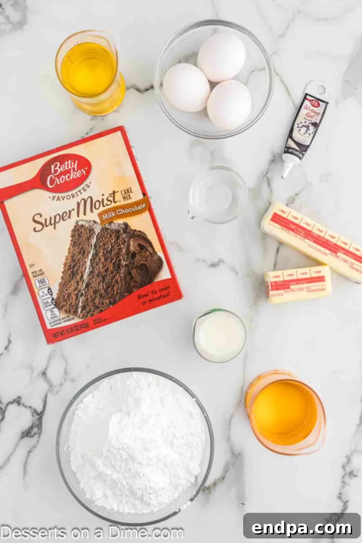 All the essential ingredients for Spider Web Cupcakes laid out: chocolate cake mix, oil, eggs, butter, powdered sugar, vanilla extract, chocolate chips, and shortening.
