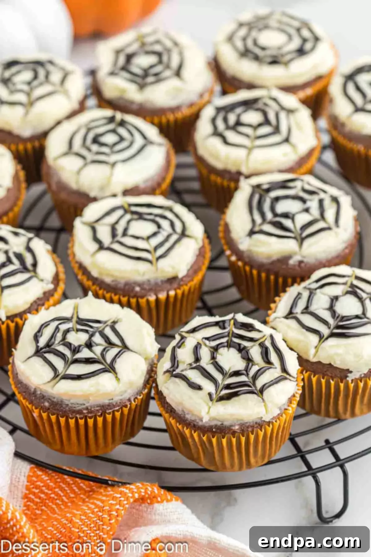 A tray of beautifully decorated Spider Web Cupcakes, perfectly presented and ready for a Halloween celebration.