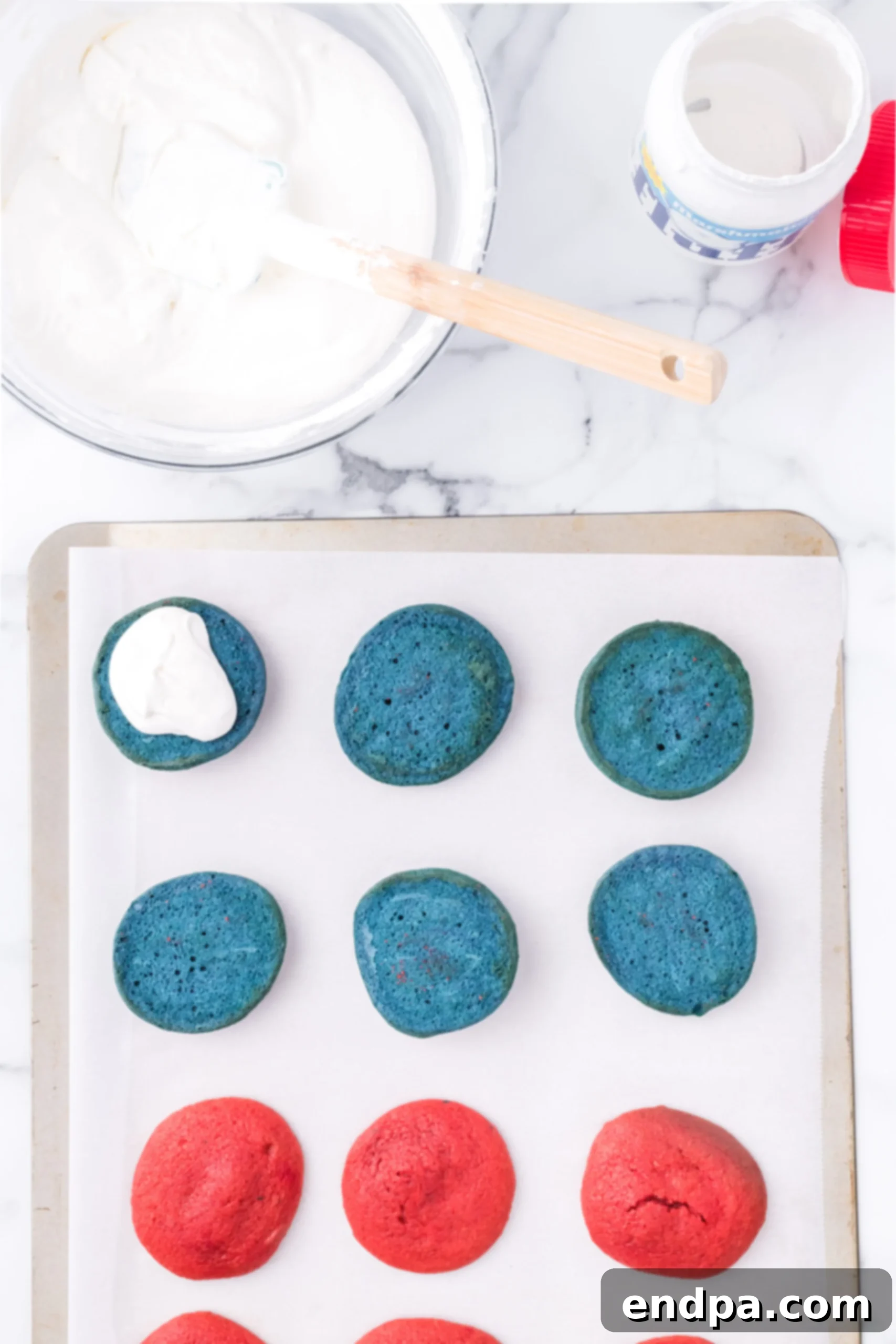 Marshmallow filling on cookies.