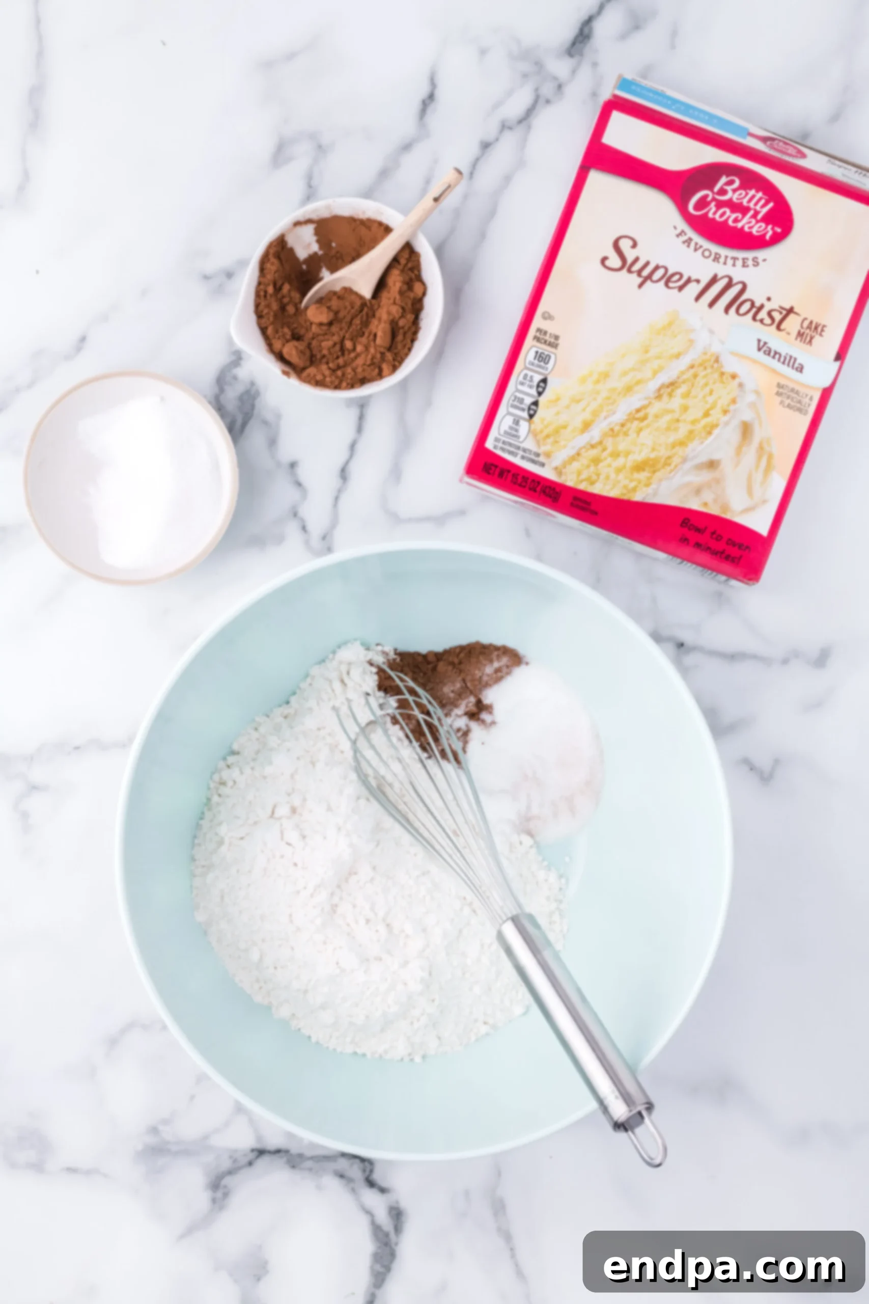 Bowl with cake mix and cocoa added.