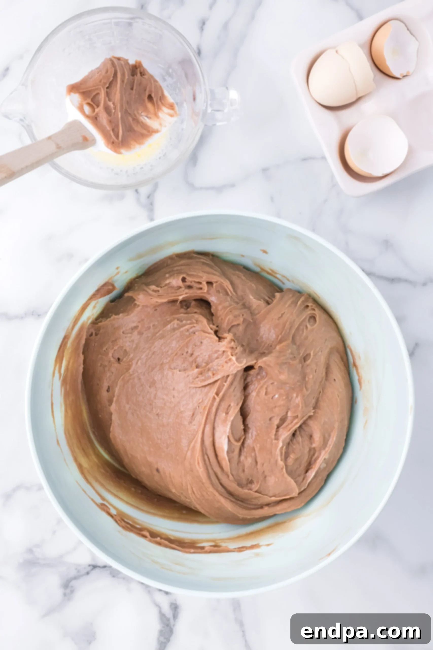 Wet and dry ingredients combined in a bowl.