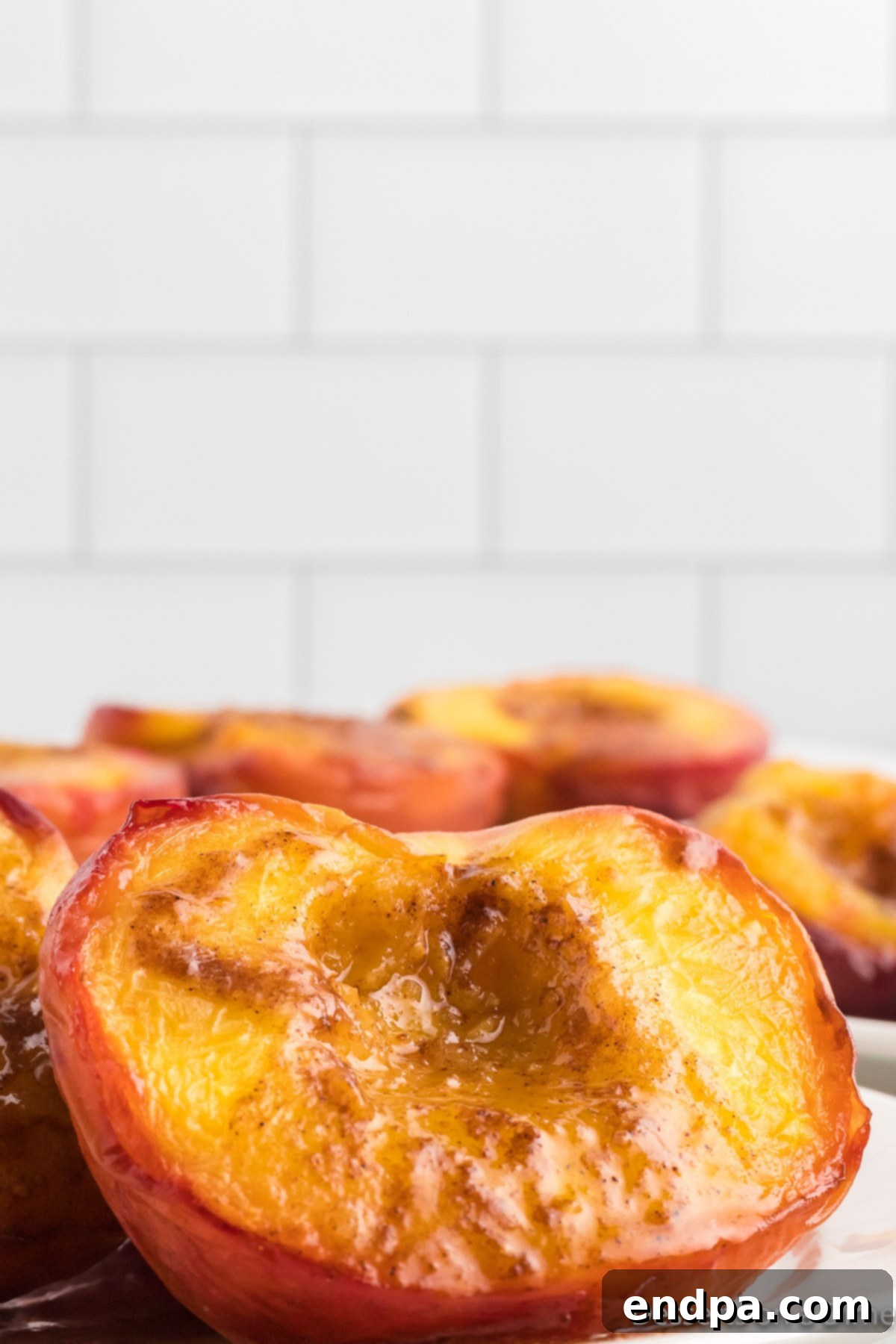 Golden Air Fryer Peaches 12 Air Fryer Peaches on a platter