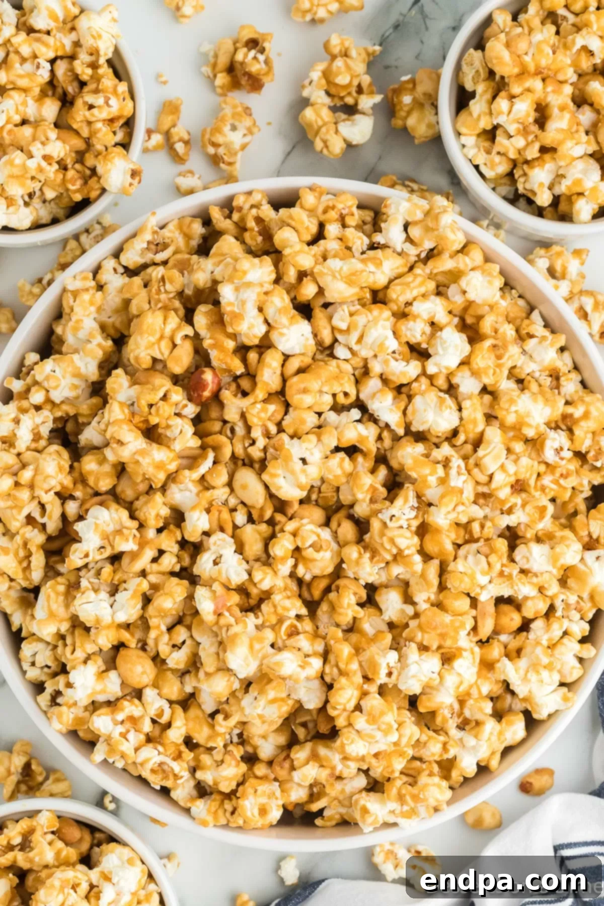 A bowl overflowing with golden, crunchy homemade Butter Toffee Popcorn, ready for sharing.
