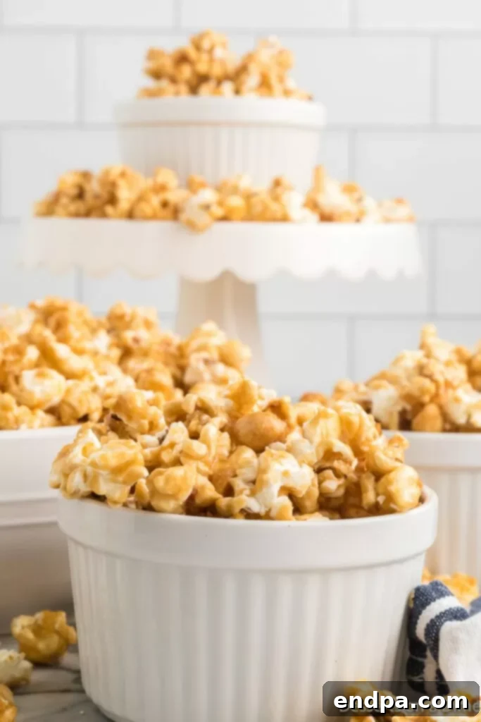 Cooling butter toffee popcorn on a baking sheet, ready to be broken into pieces.
