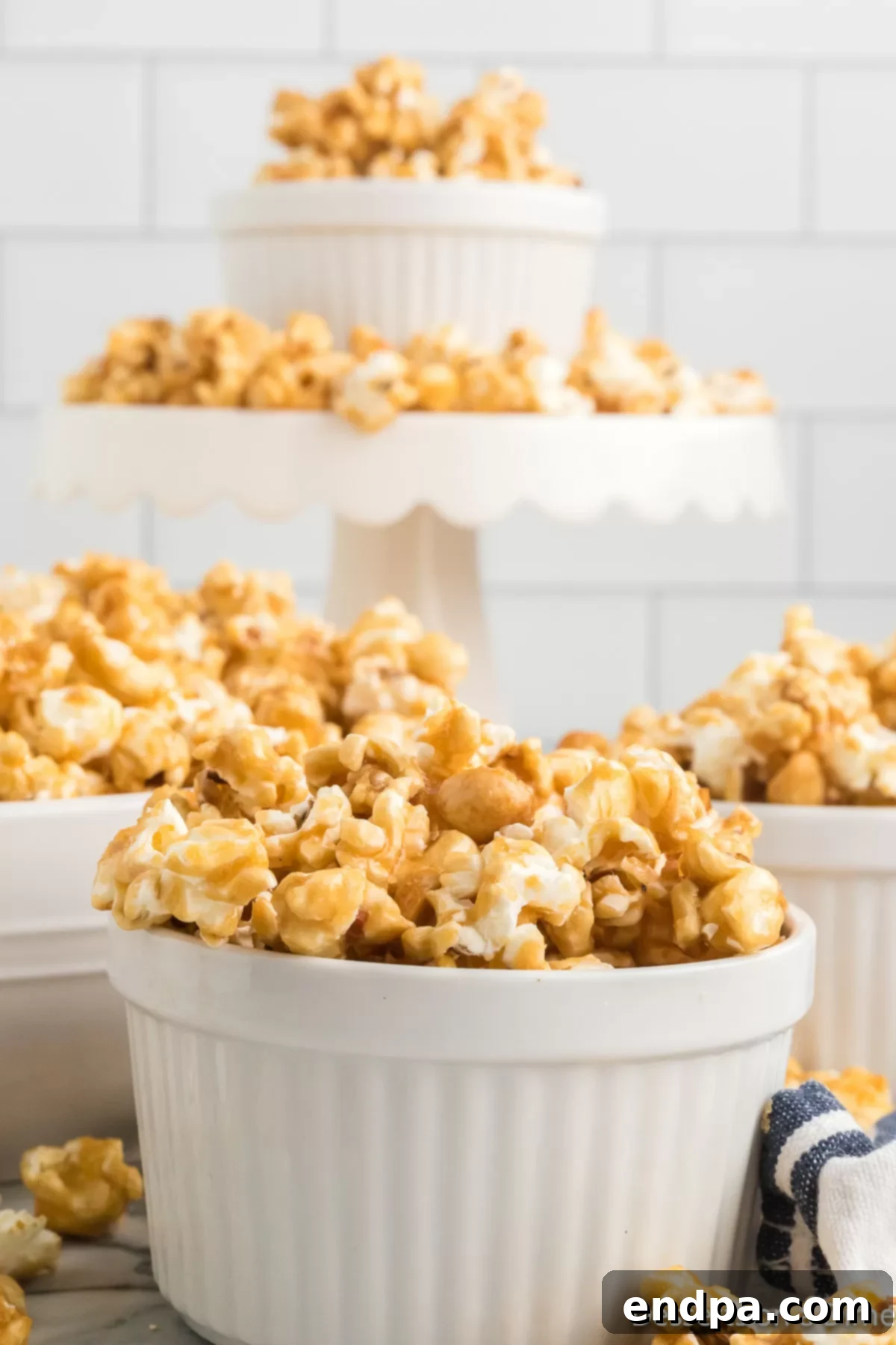 A bowl filled with delectable homemade Butter Toffee Popcorn, perfectly golden and crunchy, ready to be enjoyed.