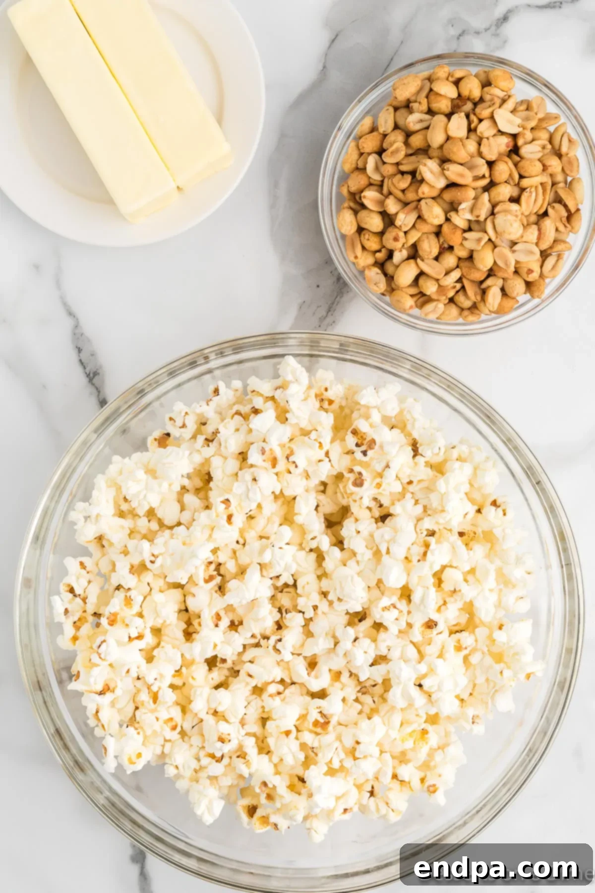 Freshly popped popcorn in a large bowl, ready for the next step in making butter toffee popcorn.