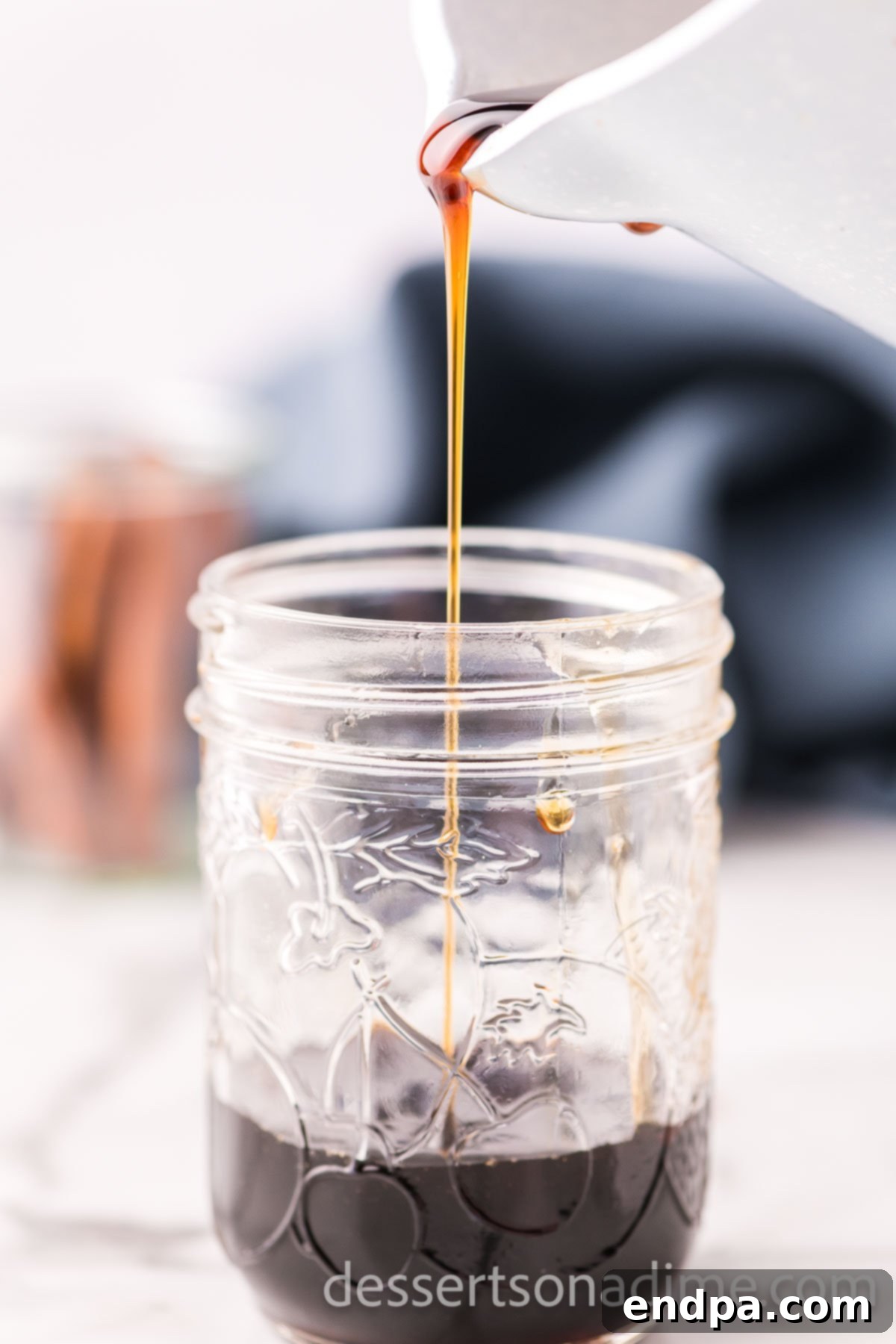 A glass jar filled with luscious homemade brown sugar syrup, ready to be used in various beverages and desserts.