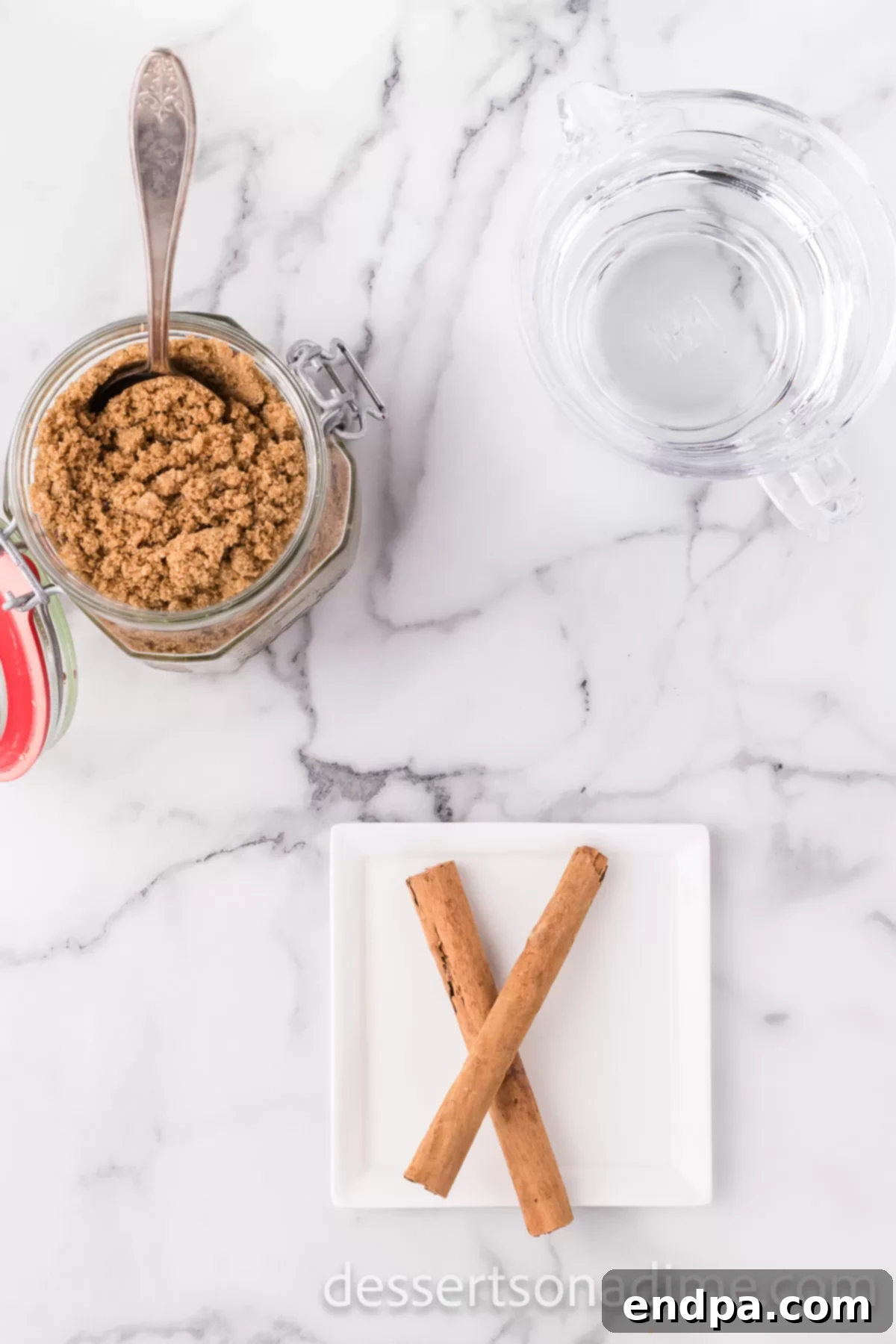 Ingredients for homemade brown sugar syrup: rich brown sugar, aromatic cinnamon sticks, and fresh water.