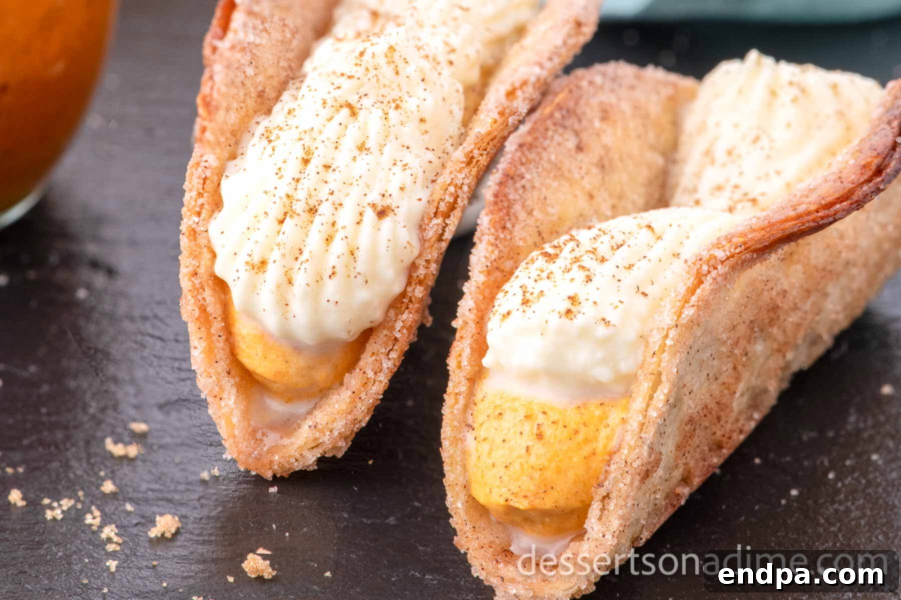 Pumpkin Pie Tacos ready to serve topped with whipped cream. 