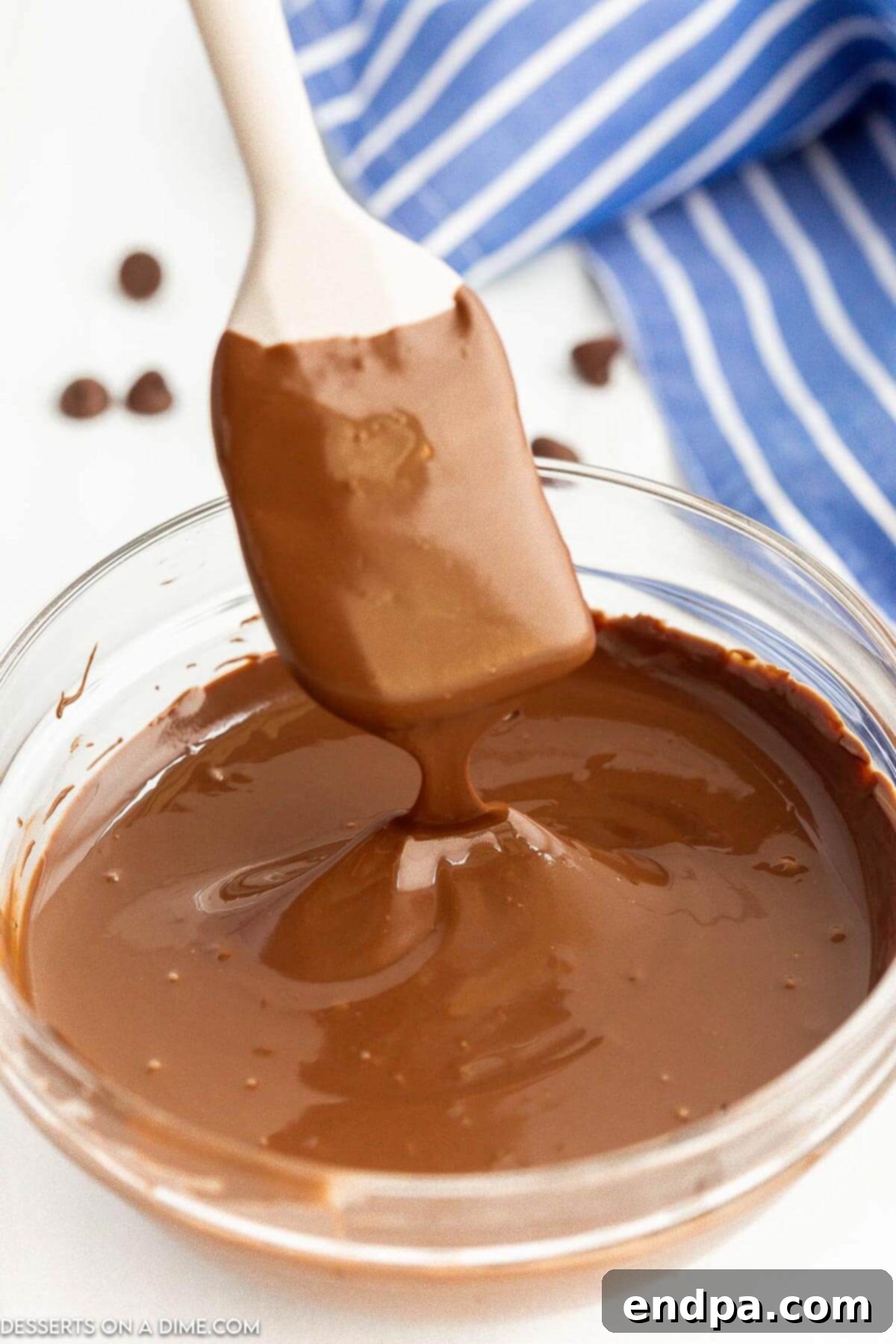 Chocolate chips melted and being stirred.