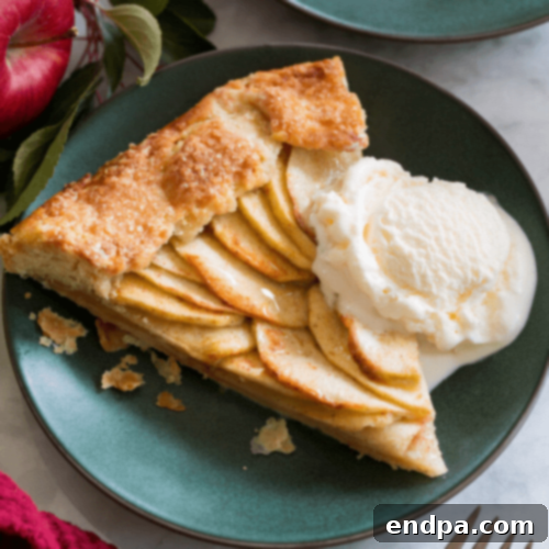 97 Effortless Autumn Delights 35 A rustic Apple Galette with thinly sliced apples and a golden, folded crust.