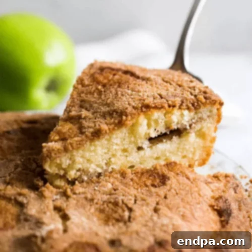 97 Effortless Autumn Delights 38 A slice of Apple Coffee Cake with streusel topping and apple chunks.