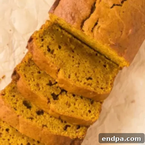 97 Effortless Autumn Delights 7 A loaf of freshly baked Pumpkin Bread, sliced and ready to serve.