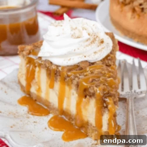 97 Effortless Autumn Delights 59 A slice of Apple Crisp Cheesecake with a creamy base and crunchy apple topping.