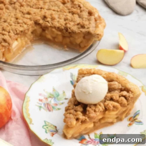 97 Effortless Autumn Delights 61 A golden Apple Crumble Pie with a lattice top and visible apple filling.