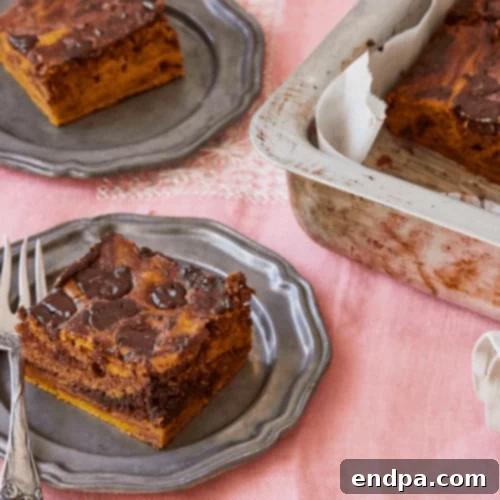 97 Effortless Autumn Delights 68 Marbled Pumpkin Pie Brownies, showing swirls of chocolate and pumpkin.