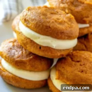 97 Effortless Autumn Delights 69 Pumpkin Whoopie Pies with creamy white filling.