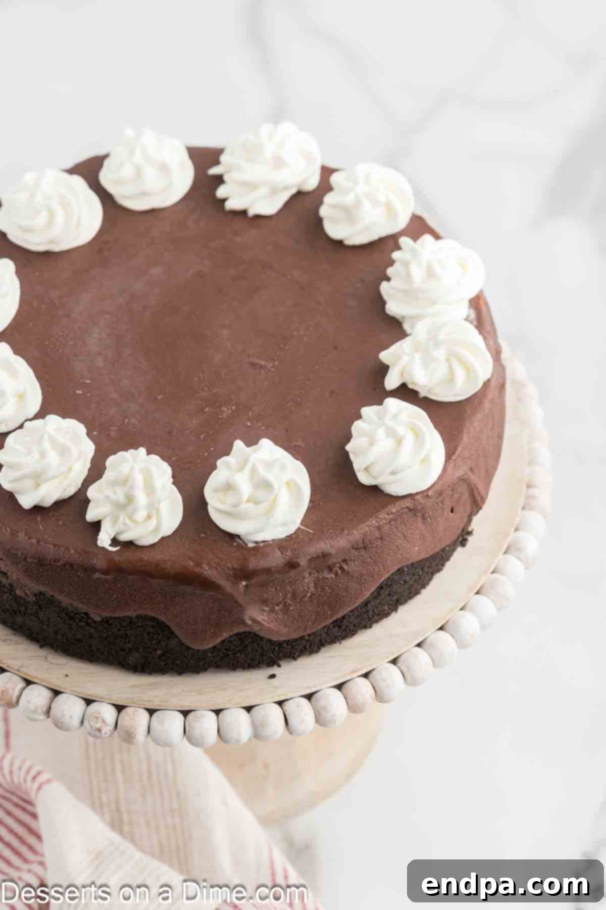 Nutella Cheesecake on a cake stand, ready to be served