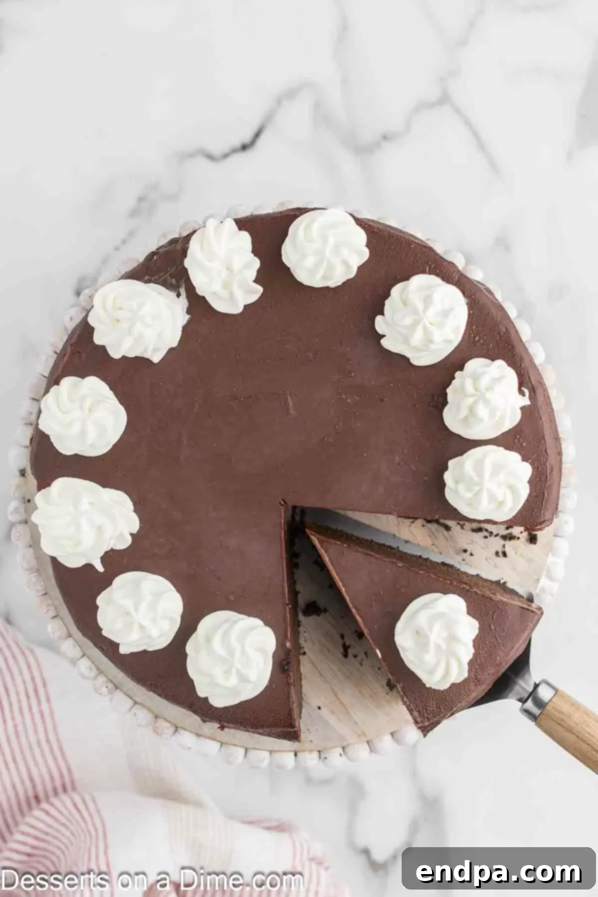 Whole Nutella Cheesecake on a decorative cake stand, ready for slicing