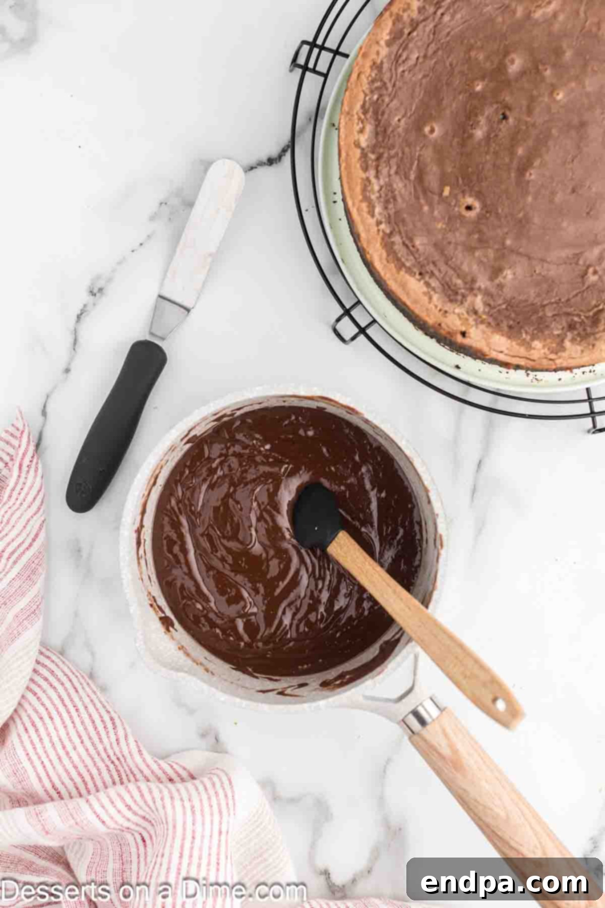 Heating heavy cream and Nutella in a small saucepan for the glaze