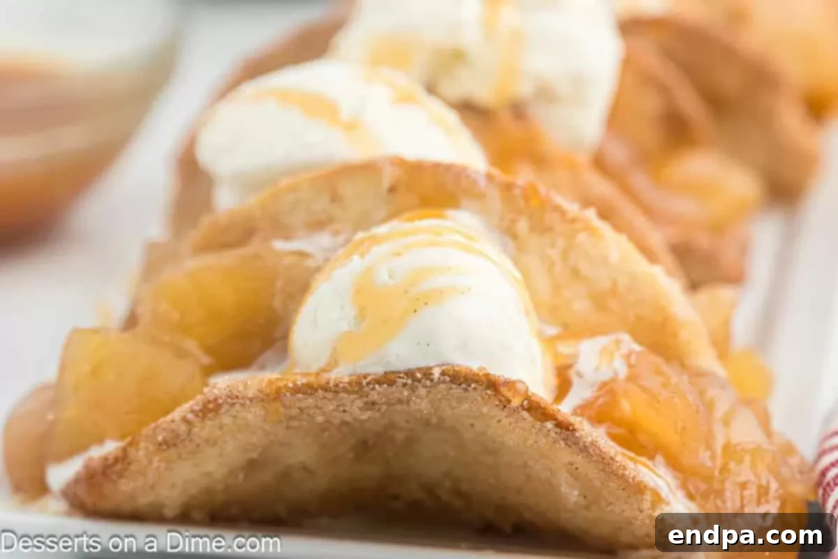 Apple Crisp Tacos 2 Apple Pie Tacos with ice cream and cinnamon sugar.