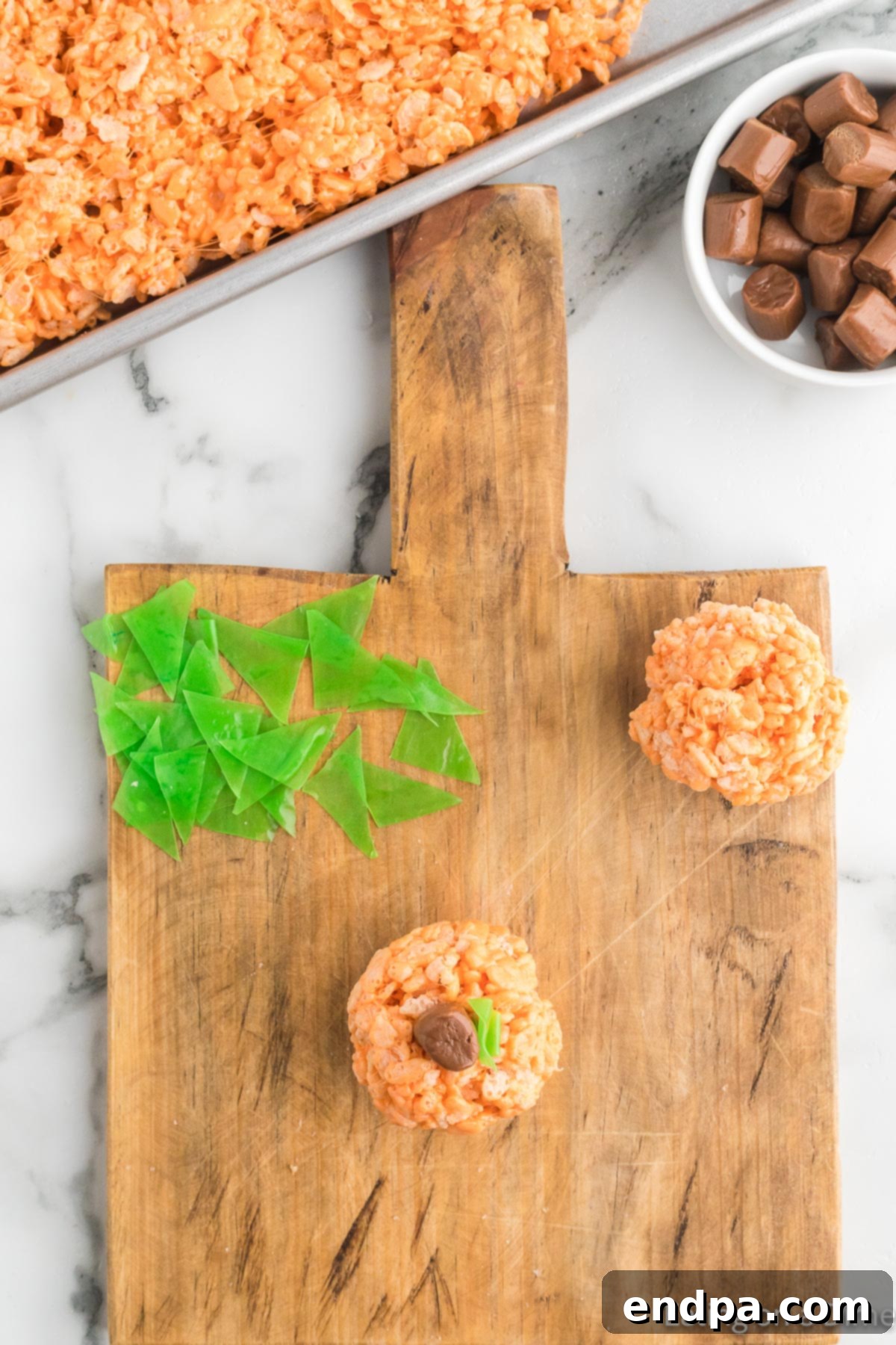 Pumpkin Patch Krispie Treats 14 Finished Rice Krispie Treat Pumpkins, each topped with a chocolate Tootsie Roll stem and a green fruit roll-up leaf.