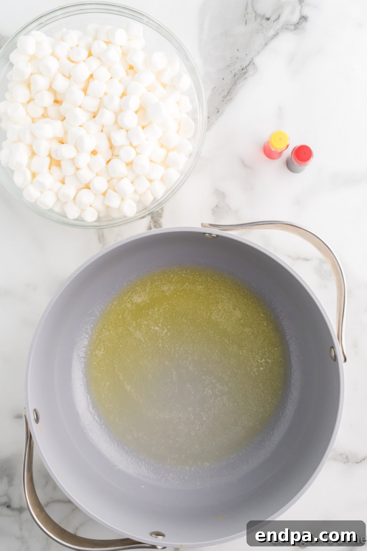 Pumpkin Patch Krispie Treats 5 Butter melting in a large saucepan over low heat.