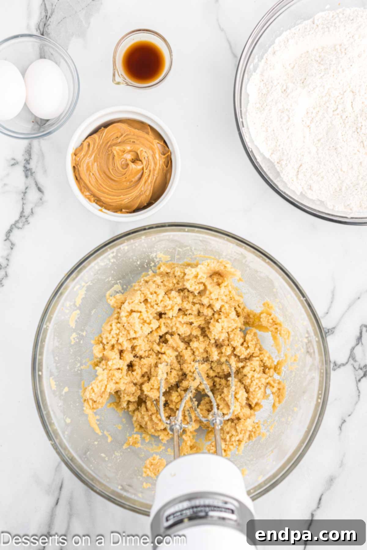 Softened butter and sugars combined in a mixing bowl until light and fluffy.