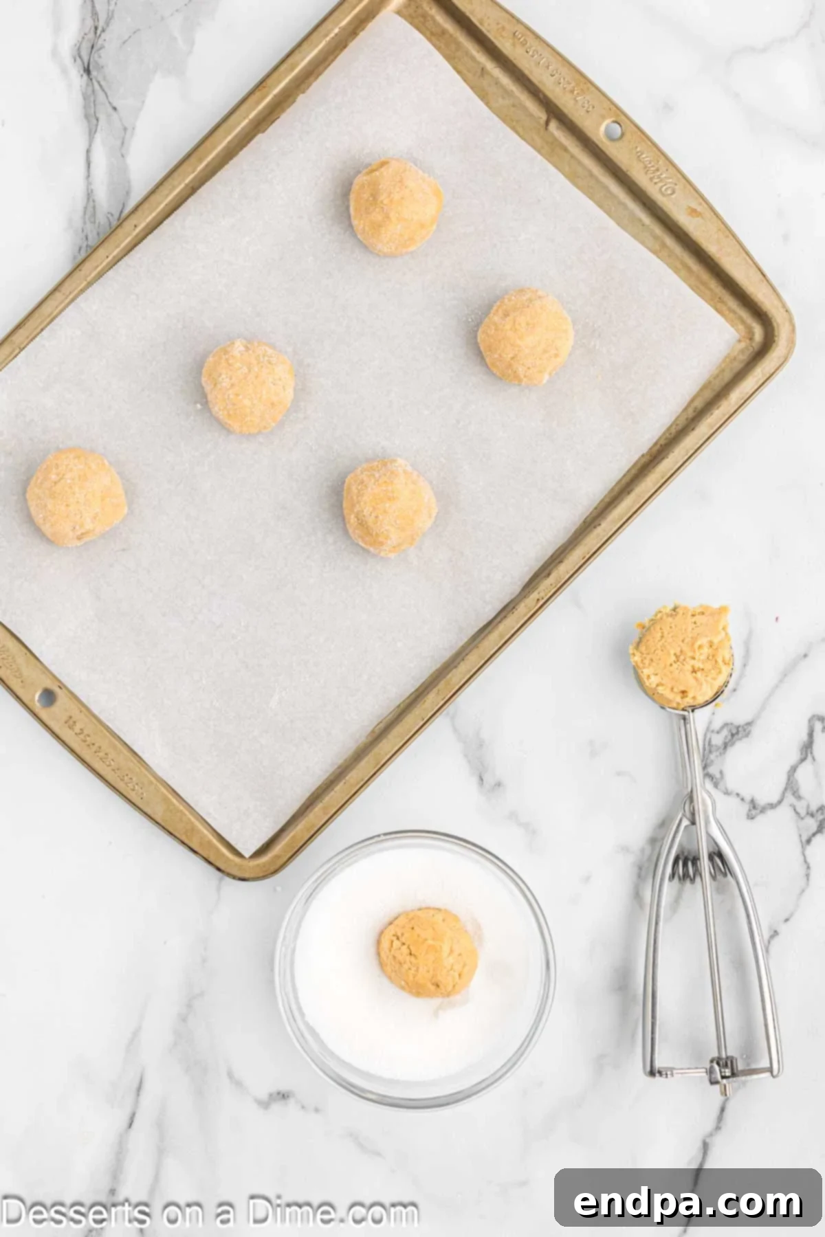 Cookie dough balls scooped and placed on an ungreased baking sheet.