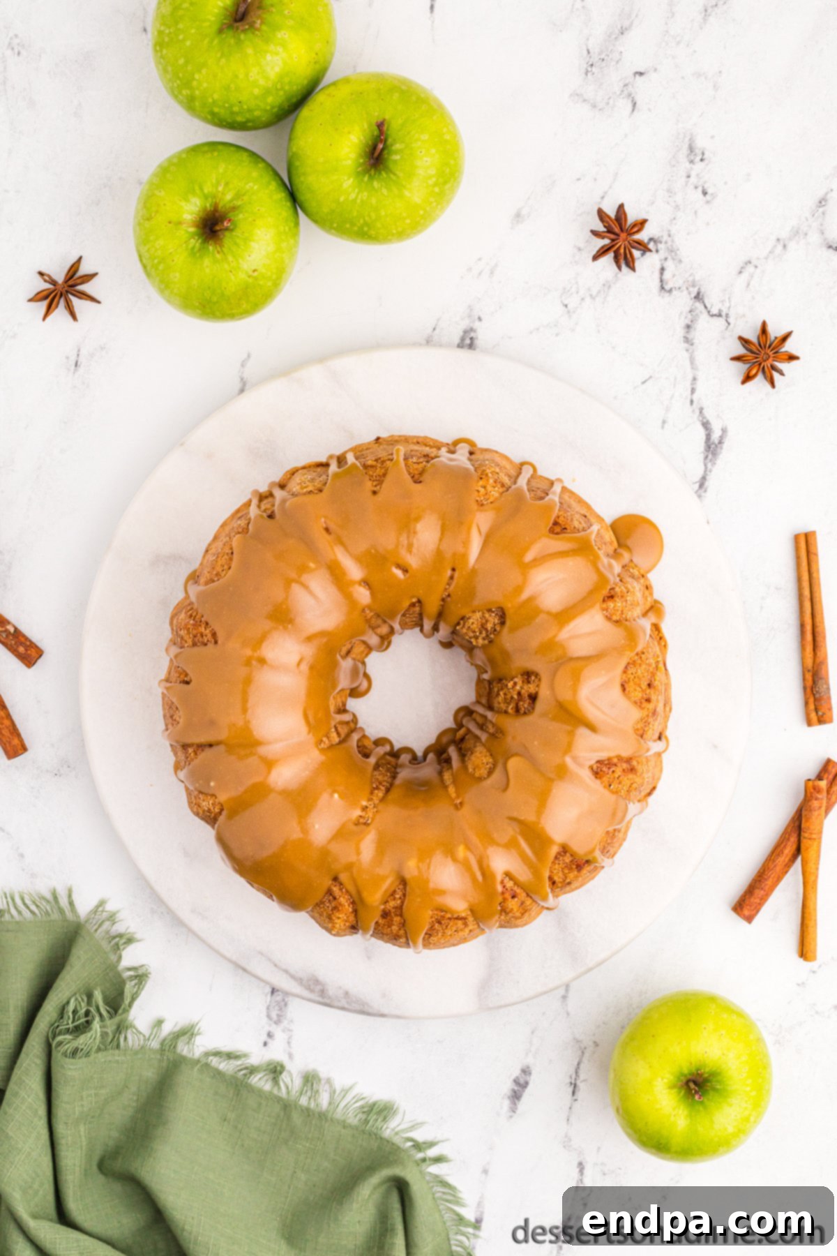 Finished apple bundt cake with brown sugar glaze, ready to be served.