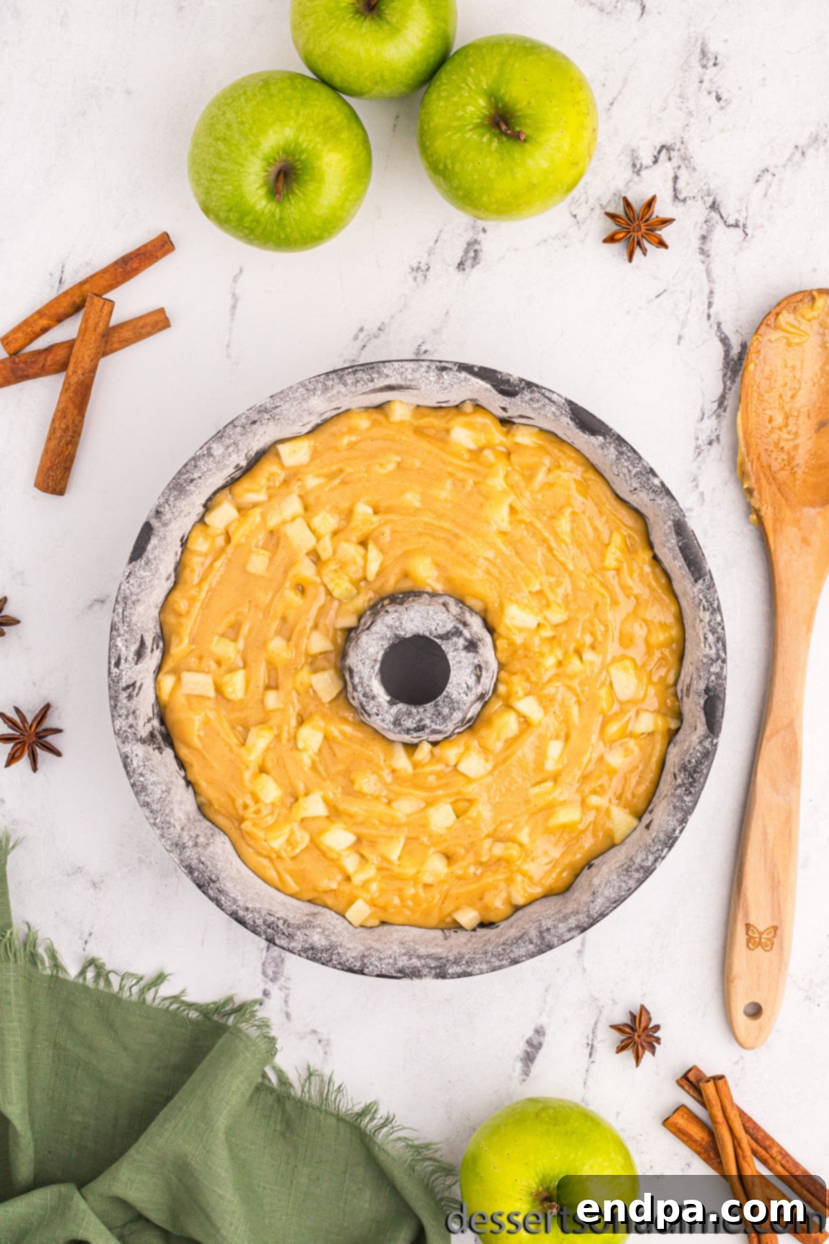 Cake batter poured into a bundt pan, ready for the oven.