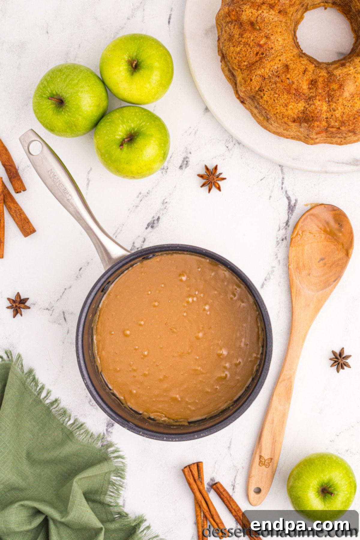 Saucepan with smooth brown sugar glaze, ready to be poured.