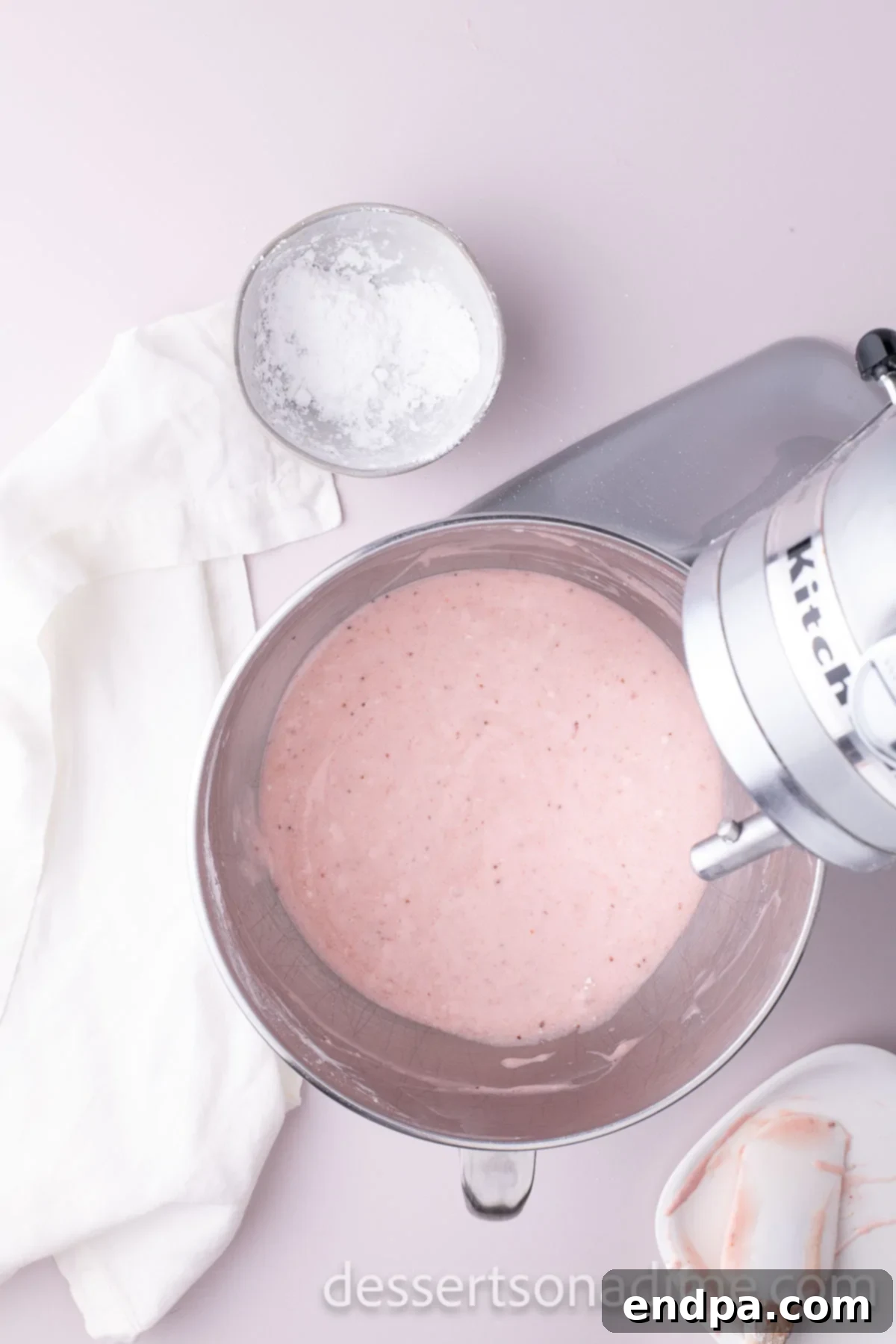 Velvety Strawberry Cream Cheese Frosting 7 The strawberry puree, butter, and cream cheese are mixed together until completely smooth and evenly combined.