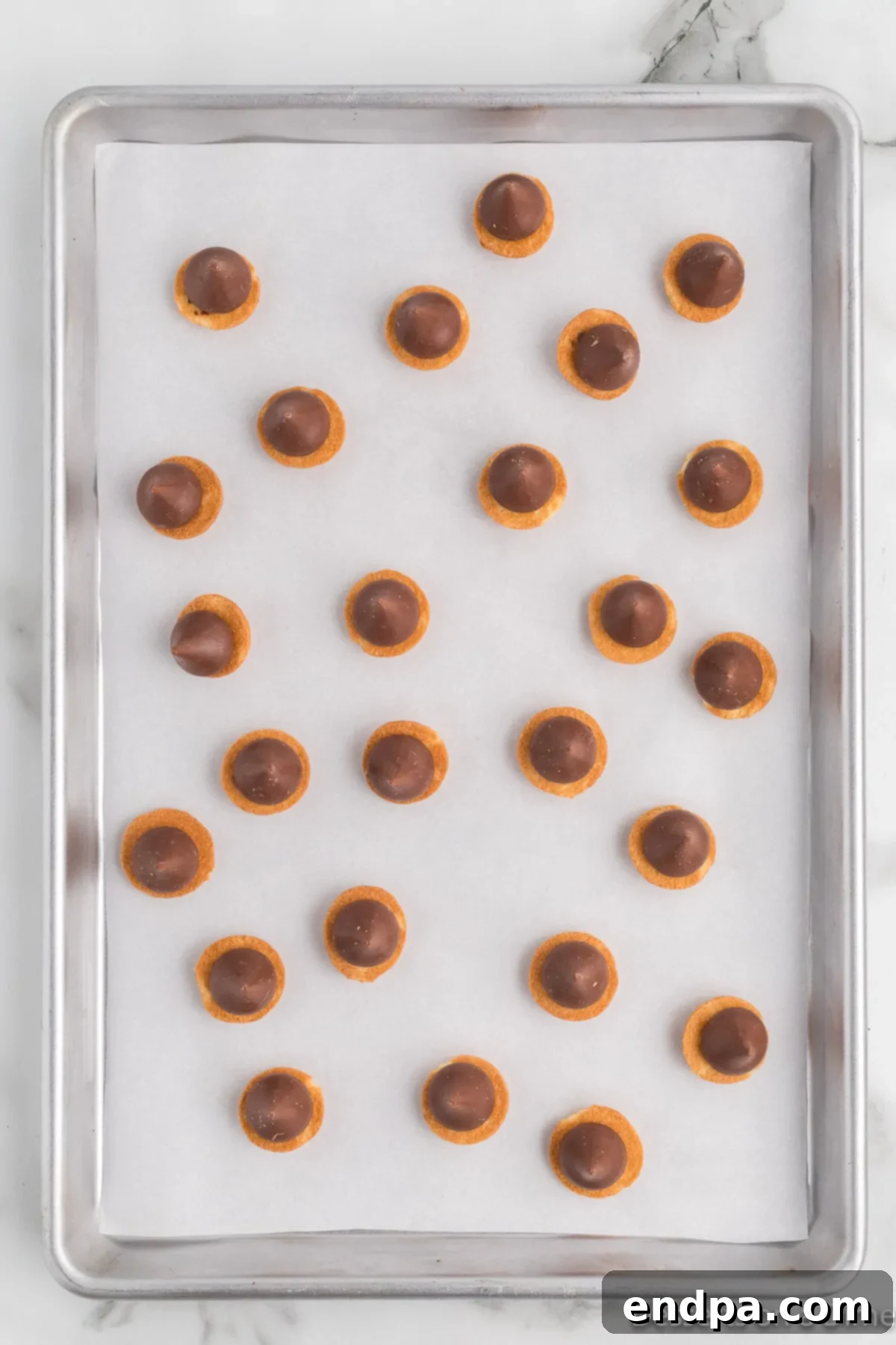 Acorn Chocolate Treasures 6 Hershey Kisses placed on vanilla wafers.