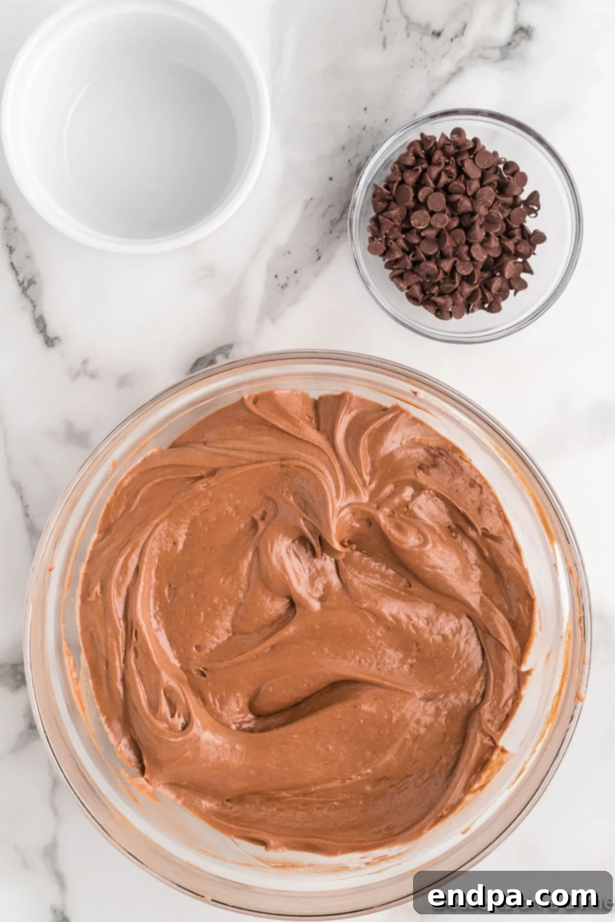 Thawed Cool Whip being gently folded into the Nutella and cream cheese mixture