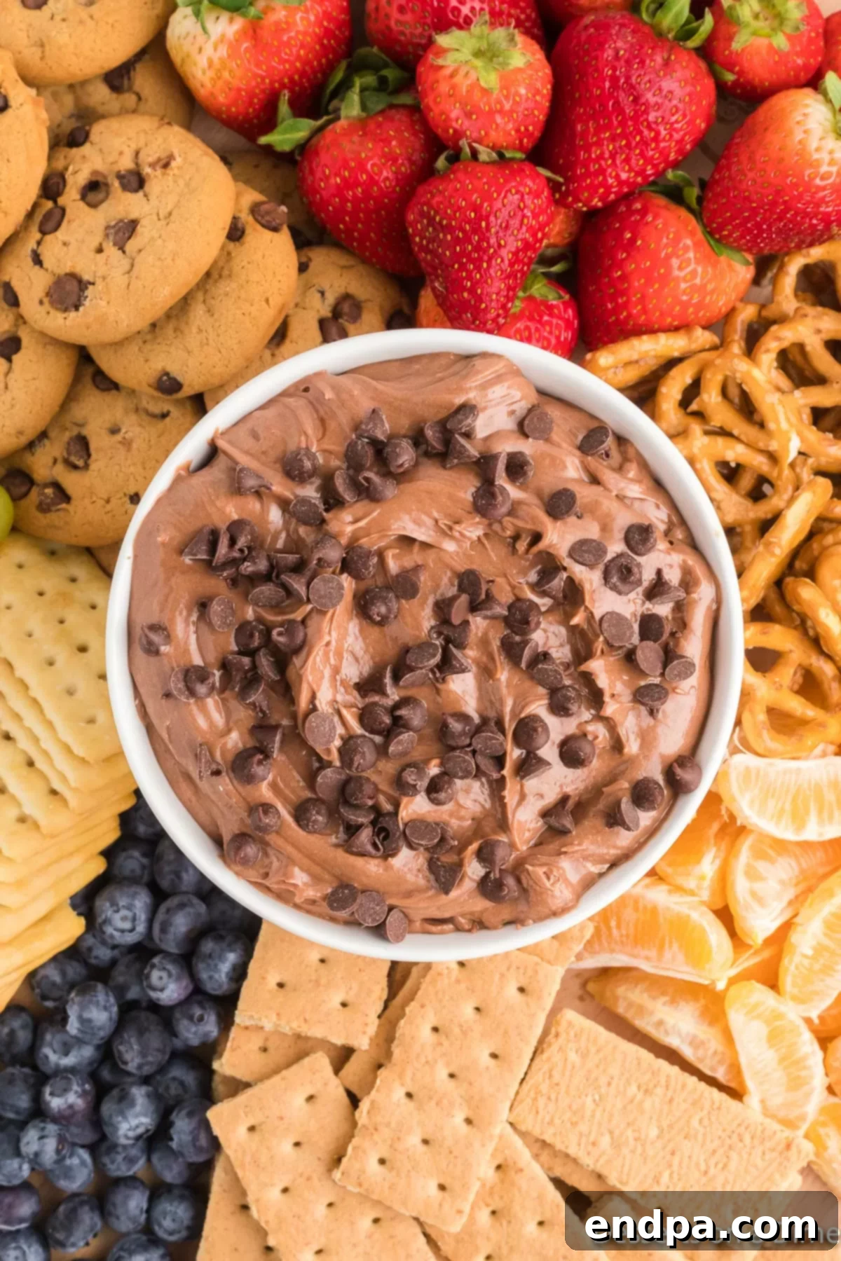 Finished Nutella dip in a serving bowl, sprinkled with mini chocolate chips