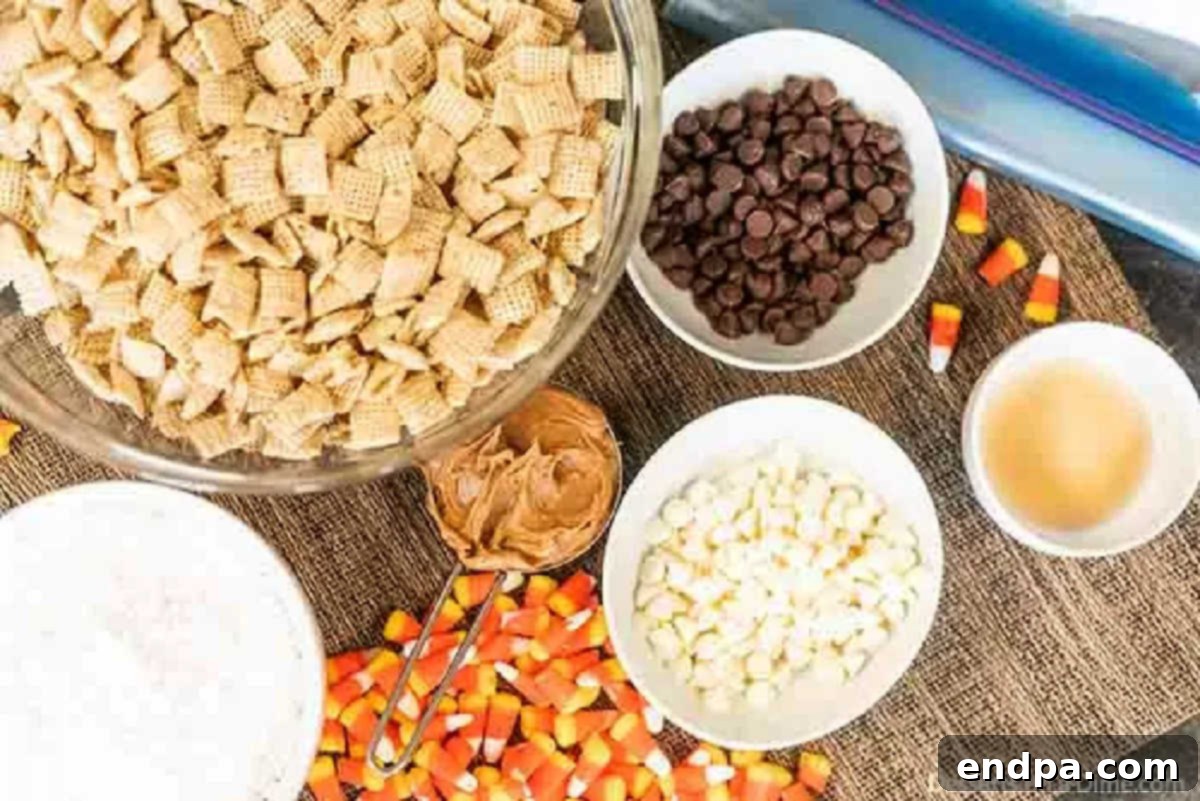 All ingredients laid out for Halloween Puppy Chow: chocolate chips, white chocolate chips, peanut butter, butter, vanilla extract, Chex cereal, powdered sugar, candy corn, and candy eyeballs.