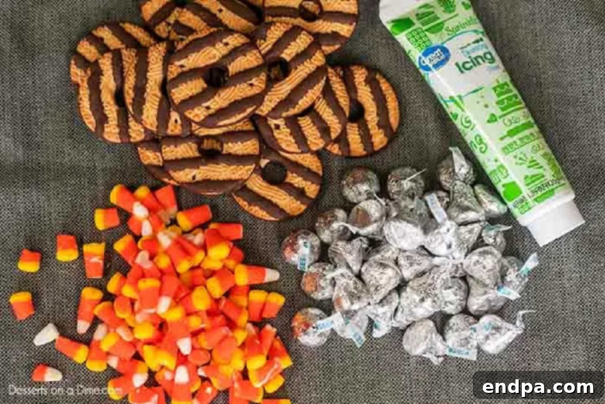 The four essential ingredients for Witch Hat Cookies: fudge stripe cookies, chocolate kisses, candy corn, and green decorating icing.