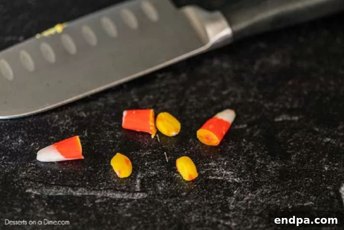 Yellow pieces of candy corn, cut to create the buckle.