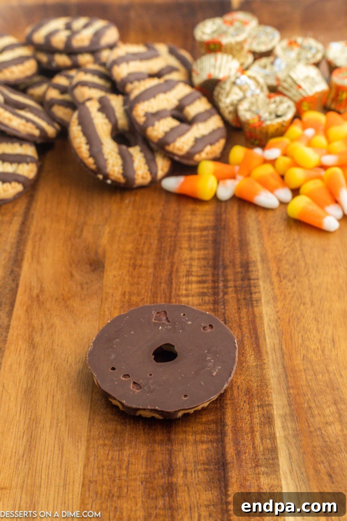 Fudge Stripe Cookie placed upside down, showcasing its chocolate bottom ready for decoration.